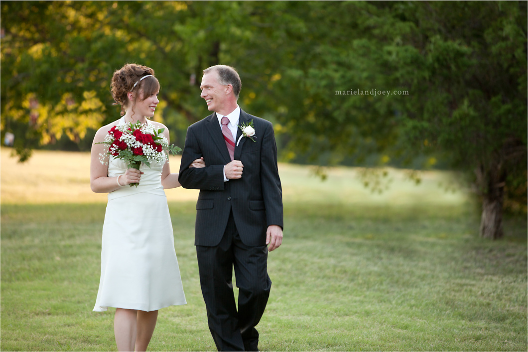 Backyard wedding in Wylie bride and father walking and looking at each other