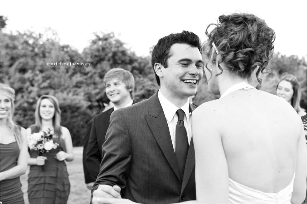 outdoor backyard wedding ceremony groom and bride smile after wedding